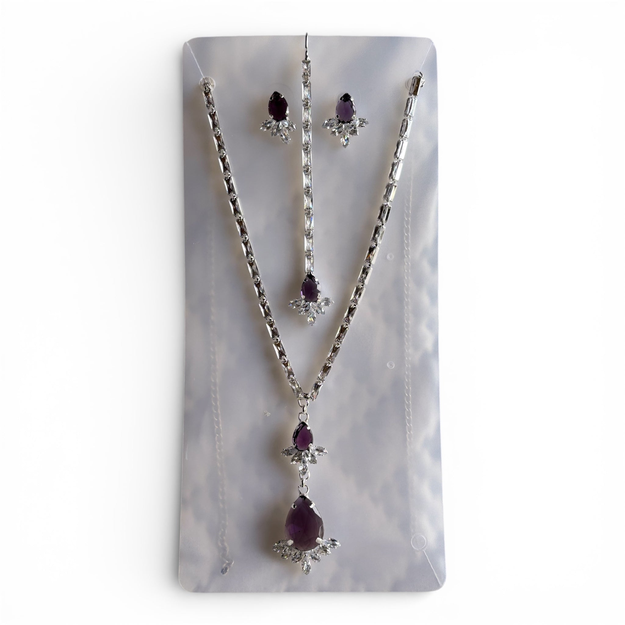 Purple Stone Cubic Zirconia Chain Necklace Pendant Earrings and Maang Tikka Set in Silver Finish Alloy Base - RYZZ