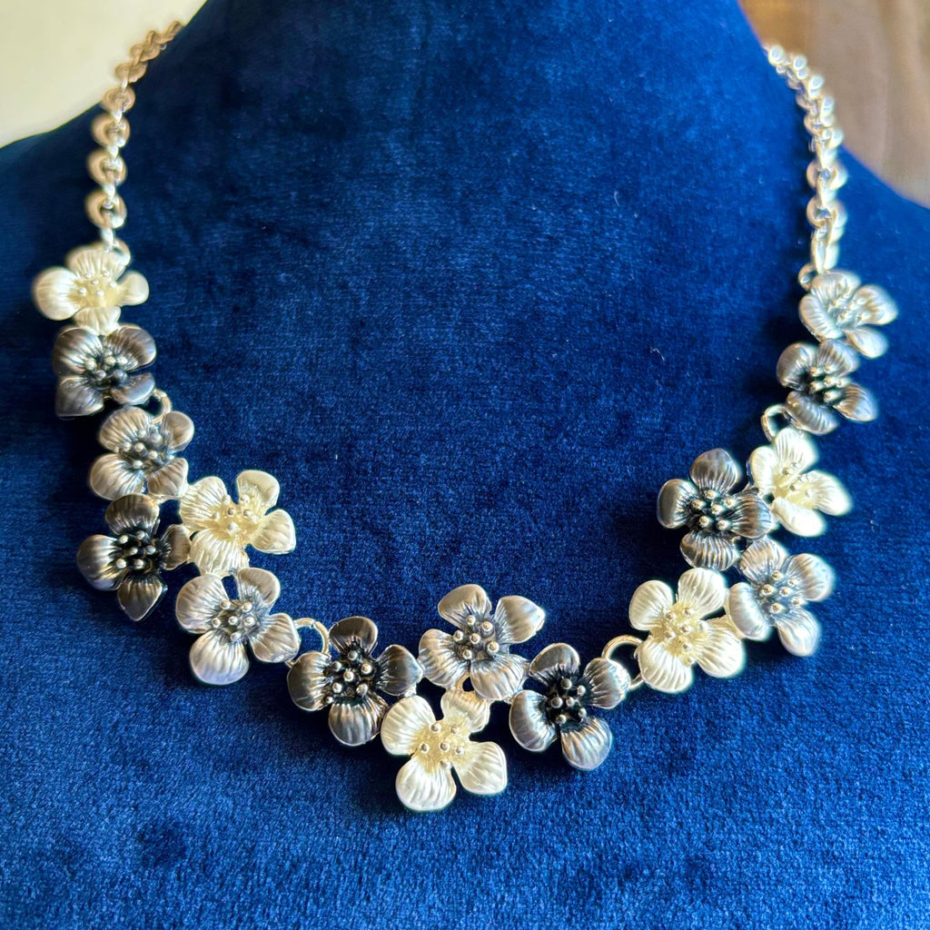 Flowers in Multi Colors Brought Together in a Brass Necklace to make a Statement - RYZZ
