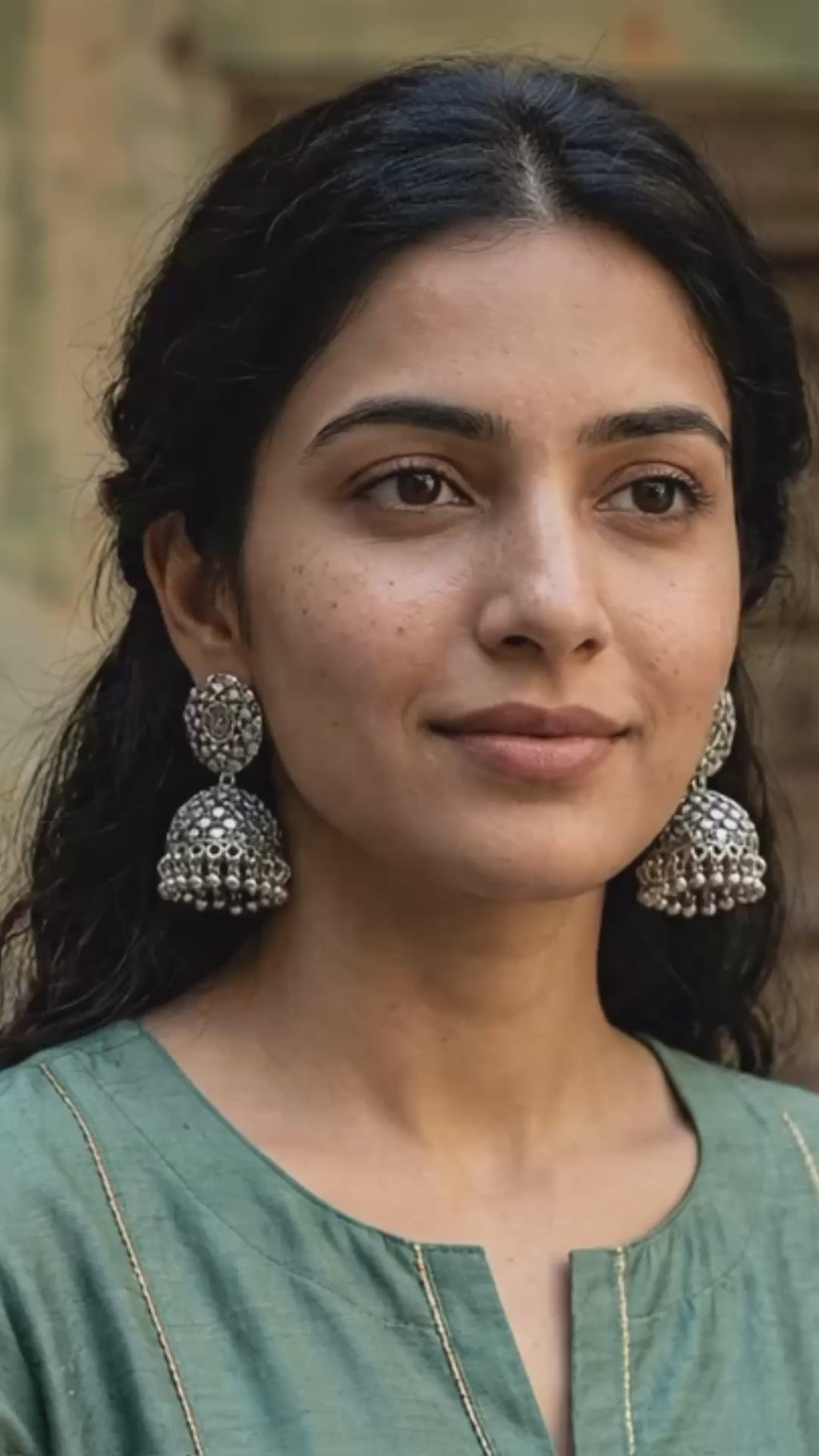 Pair of Ornate Earrings with Silver Details